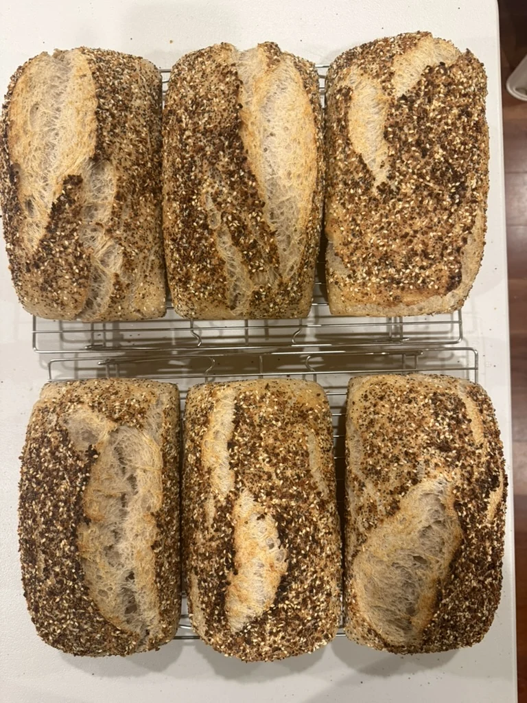 Fresh everything loaves cooling on racks